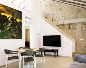 a living room with a large painting on the wall at Galathea House in Kotor