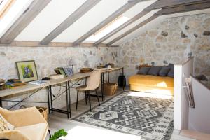 a bedroom with a desk and a bed in a room at Galathea House in Kotor