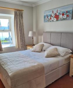 Voodi või voodid majutusasutuse Roundstone House Hotel toas