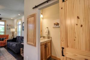 a kitchen and a living room with a couch at Modern 3bd cabin in Edgewater in Granby