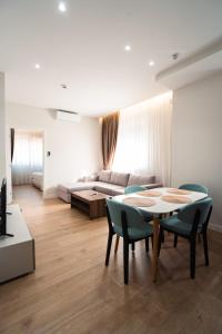 Ένα ή περισσότερα κρεβάτια σε δωμάτιο στο Tirana Elite Apartments