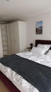 Ein Bett oder Betten in einem Zimmer der Unterkunft NEU! Ferienwohnung Flut Ostfriesland