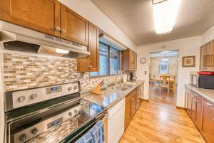 a kitchen with stainless steel appliances and wooden cabinets at Indian Paintbrush in Leadville
