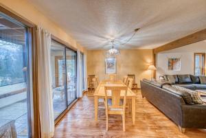 a living room with a couch and a table at Indian Paintbrush in Leadville +47 photos