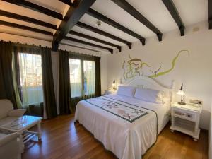 Postel nebo postele na pokoji v ubytování Hotel Doña Teresa