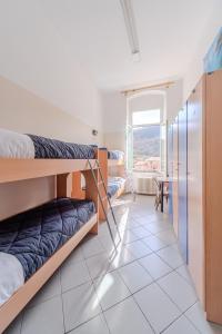 Postel nebo postele na pokoji v ubytování Ostello Tramonti
