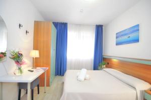 Voodi või voodid majutusasutuse Hotel Rex toas