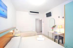 Voodi või voodid majutusasutuse Hotel Rex toas