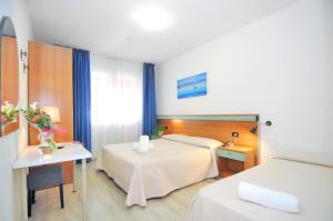 Voodi või voodid majutusasutuse Hotel Rex toas