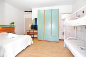 Voodi või voodid majutusasutuse Hotel Rex toas