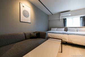 Voodi või voodid majutusasutuse bHOTEL Origaminn 702 - 5 mins PeacePark toas