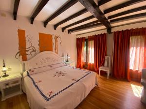 Postel nebo postele na pokoji v ubytování Hotel Doña Teresa