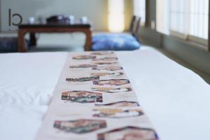 Ένα ή περισσότερα κρεβάτια σε δωμάτιο στο Hanagin by b hotel - Spacious 2 bedroom Japanese Apt for 10 ppl 401 +39 φωτογραφίες