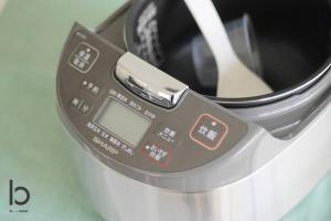 a close up of a toaster with a digital meter at IS bld 201 by b hotel - Spacious Studio Apt for 4ppl Close to Peace Park in Hiroshima