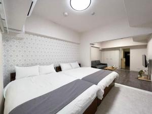 Postel nebo postele na pokoji v ubytování Casaen - Spacious 1BR Apt For 6 Ppl Great Location with room wifi + 27 fotografií