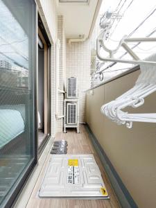 a view of a room with a window and a floor at bHOTEL Casaen - 1BR with balcony near Hondori Shopping Arcade, 6PPL in Hiroshima
