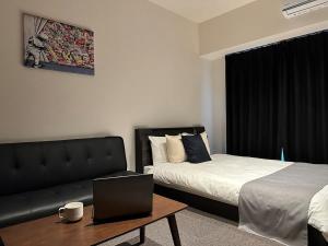 Postel nebo postele na pokoji v ubytování bHOTEL Nagomi - Well-Furnished with balcony Apt for 3 Ppl