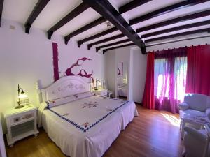 Postel nebo postele na pokoji v ubytování Hotel Doña Teresa
