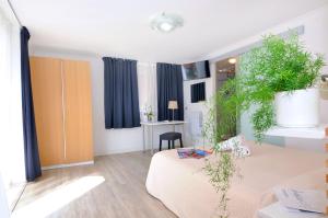 TV a/nebo společenská místnost v ubytování Hotel Rex