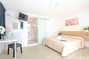 Voodi või voodid majutusasutuse Hotel Rex toas
