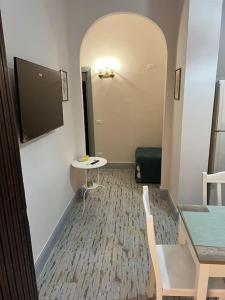 a room with a table and a table and a table and a table at MareaSol Casa Vacanze in Santa Maria di Castellabate