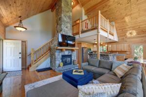 a living room with a couch and a fireplace at Berkshire Vacation Rentals: Great Barrington Cabin Sleeps 14 Walk To Town in Great Barrington
