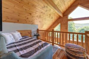 a bedroom with a bed in a wooden cabin at Berkshire Vacation Rentals: Great Barrington Cabin Sleeps 14 Walk To Town in Great Barrington