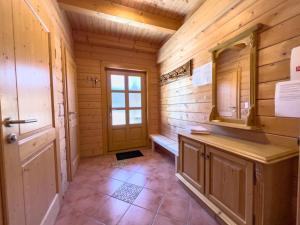 a bathroom with a bench in a wooden cabin at 1A Chalet Enzianhuette - im Wander und Skigebiet in Elsenbrunn