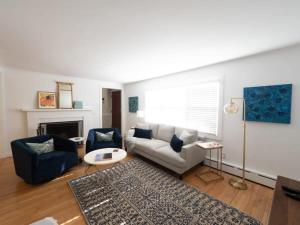 a living room with a couch and a fireplace at Berkshire Vacation Rental: Stockbridge Home Come Experience The Berkshires in Stockbridge