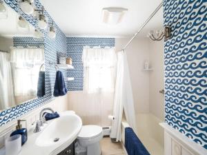 a bathroom with a white sink and a toilet at Berkshire Vacation Rental: Stockbridge Home Come Experience The Berkshires in Stockbridge +27 photos