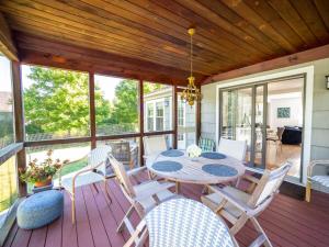 a patio with a table and chairs on a deck at Berkshire Vacation Rental: Stockbridge Home Come Experience The Berkshires in Stockbridge