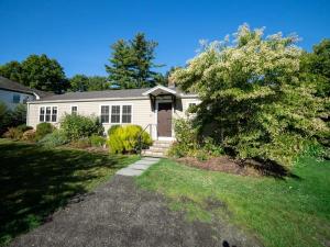 a white house with a tree in front of it at Berkshire Vacation Rental: Stockbridge Home Come Experience The Berkshires in Stockbridge