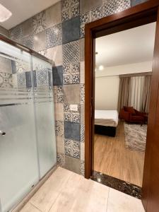 a glass door leading to a room with a bedroom at White Palace Boutique Hotel in Cairo