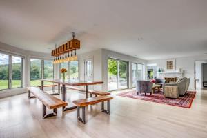 a large living room with a table and a couch at Berkshire Vacation Rentals: The Brookman: Renovated 6000 SF Estate On 40 Acres in Williamstown