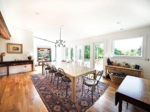 a dining room with a table and chairs at Berkshire Vacation Rentals: Mountain View Estate Sleeps 18 in North Egremont