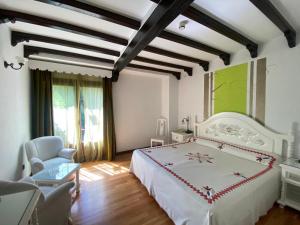 Postel nebo postele na pokoji v ubytování Hotel Doña Teresa