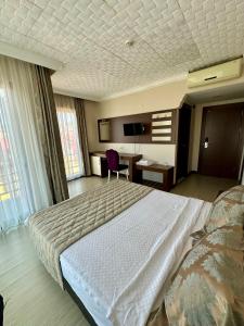 Postel nebo postele na pokoji v ubytování Hotel Avci