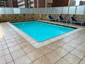 a swimming pool on top of a building at Ocean's 68 in Durban