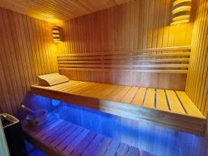 a small wooden sauna with a bench in it at KERLAGATU in Quimper