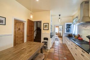 a kitchen with a wooden counter top in a room at Josephine in Leadville +8 photos
