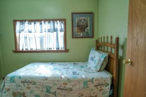 a bedroom with a bed and a window at Fairhaven in Leadville