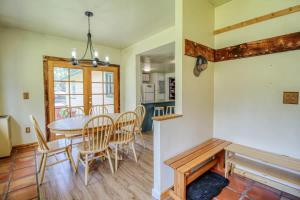 a kitchen and dining room with a table and chairs at Mountain Bluebell Cabin in Leadville