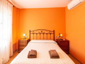 Postel nebo postele na pokoji v ubytování Casa rosa del romeral