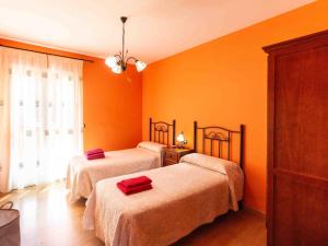Postel nebo postele na pokoji v ubytování Casa rosa del romeral