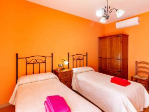 Postel nebo postele na pokoji v ubytování Casa rosa del romeral