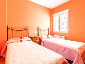 Postel nebo postele na pokoji v ubytování Casa rosa del romeral