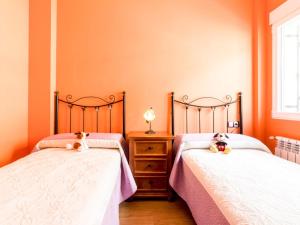 Postel nebo postele na pokoji v ubytování Casa rosa del romeral