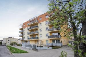 an apartment building with balconies on a street at 32 Gdynia Oksywie - Apartament Mieszkanie dla 4 os in Gdynia