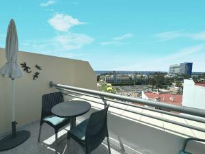 Balkon lub taras w obiekcie Palm Garden Apartment