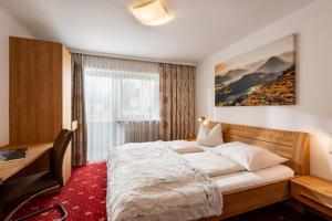 Łóżko lub łóżka w pokoju w obiekcie Appartements Herold